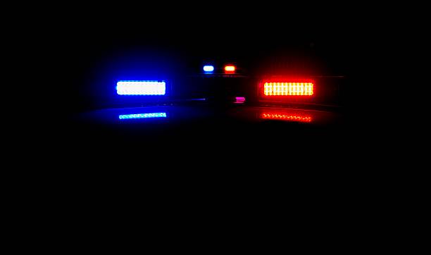istockphoto-464821151-612x612 Police lights at a crime scene at night. One police car was parked behind the other with its lights on.