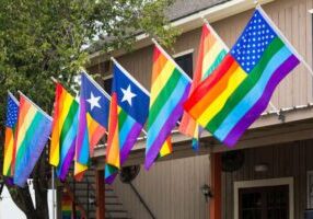 A gay US flag, USA Rainbow flag, US gay pride flag is proudly displayed in the city of Houston, Texas